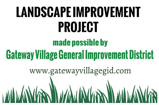 A sign for a Landscape Improvement Project by Gateway Village General Improvement District with a website link.