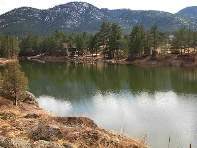 Photo of mountains, trees and water