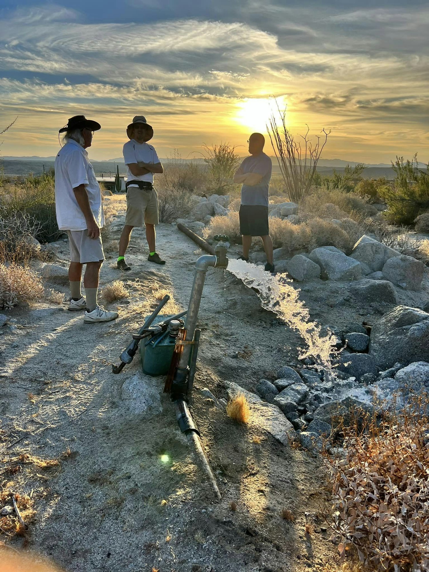 May contain: nature, outdoors, sky, rock, clothing, and shorts