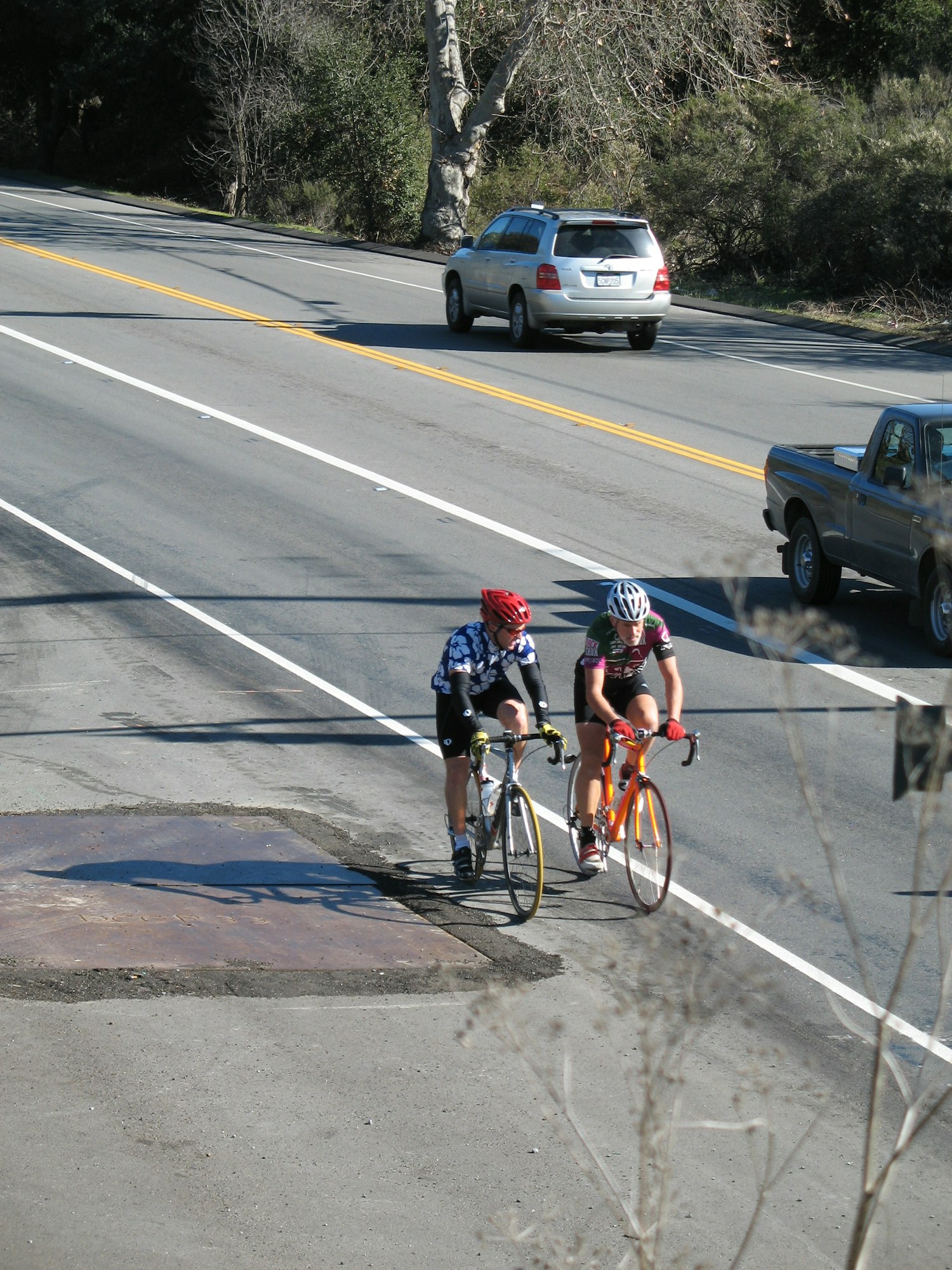 May contain: person, human, bicycle, bike, vehicle, transportation, wheel, machine, road, tarmac, asphalt, car, and automobile