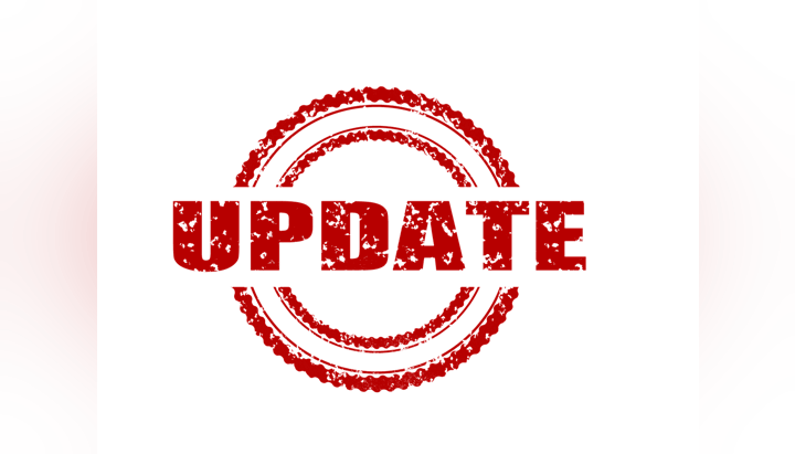 The image shows the word "UPDATE" in bold, distressed red letters within a circular stamp design.