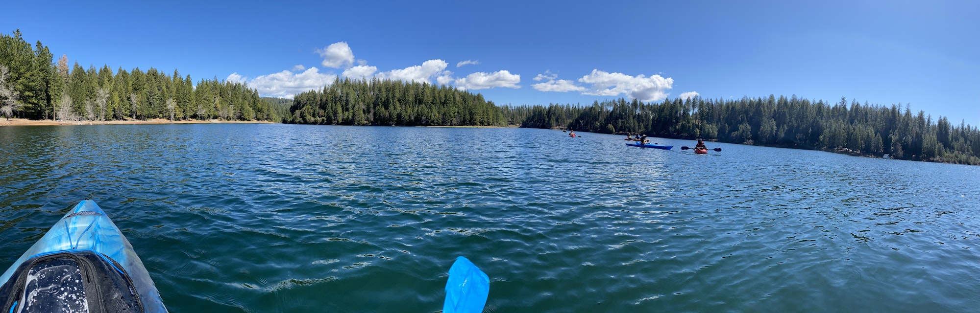 May contain: nature, outdoors, scenery, landscape, lake, water, boat, canoe, rowboat, transportation, vehicle, fir, plant, tree, and person