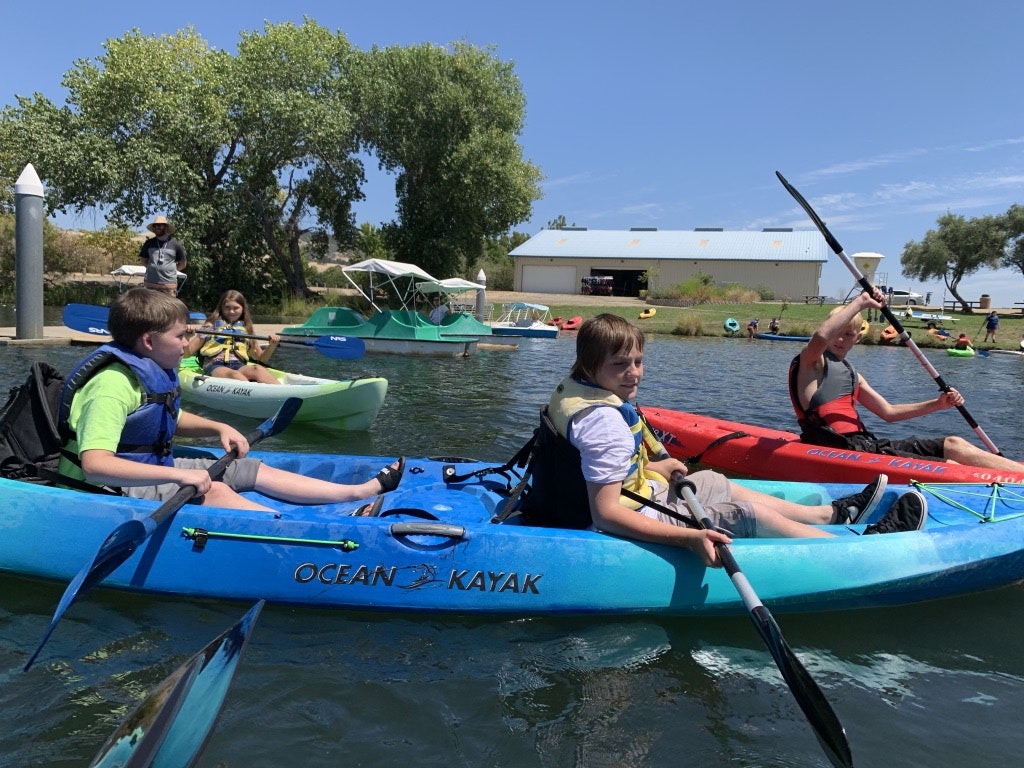 May contain: person, human, oars, rowboat, boat, transportation, vehicle, kayak, and canoe