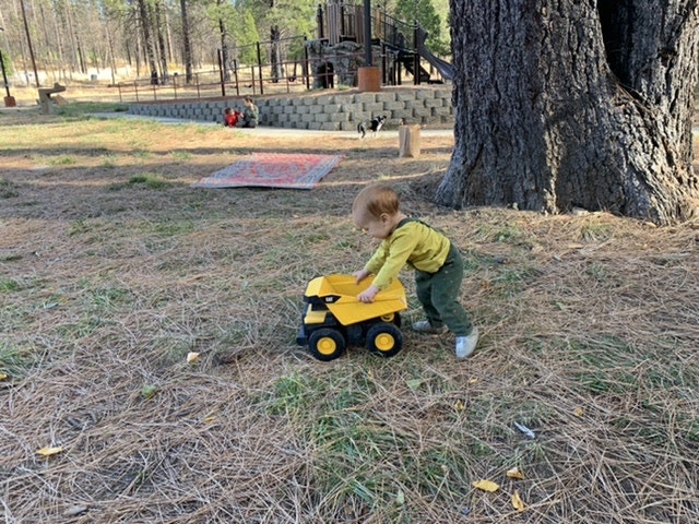 Tiny tot enjoying "driving" their Tonka Truck at Crain Park