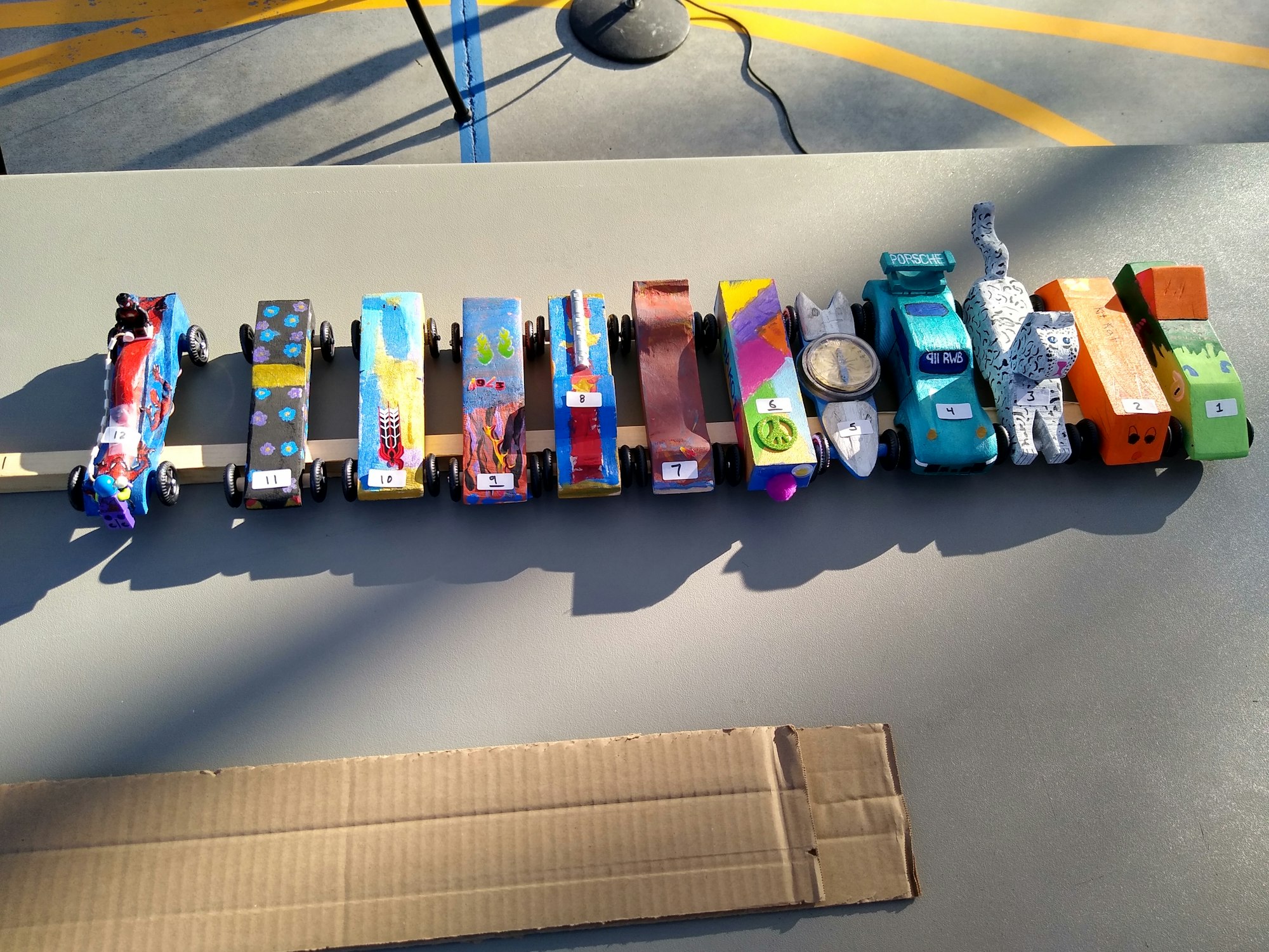 toy race cars lined up on a table