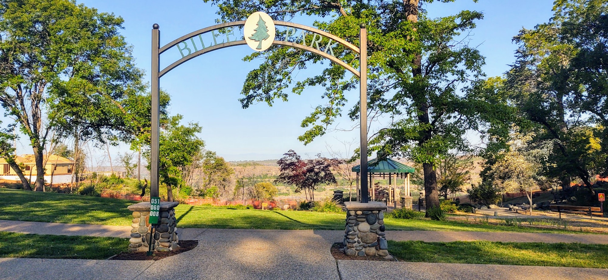 Bille Park entrance sign with view of canyon behind