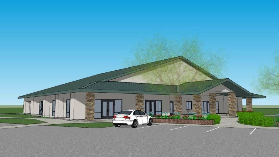 3D rendering of a single-story building with parking, a sedan out front, clear sky, and minimal landscaping.