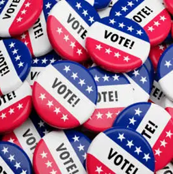 A collection of buttons featuring red, white, and blue colors with the word "VOTE!" prominently displayed.