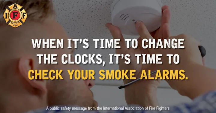 Man checking a smoke alarm with text: "When it’s time to change the clocks, it’s time to check your smoke alarms." Fire Fighters logo present.