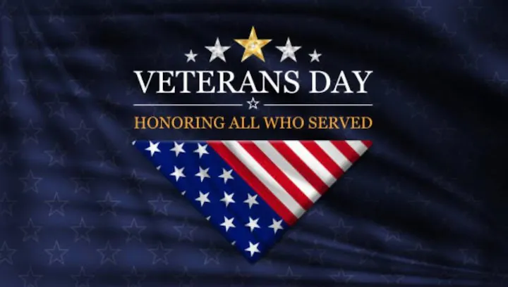 A graphic celebrating Veterans Day, featuring a star, text "Veterans Day," and "Honoring All Who Served" with an American flag design.
