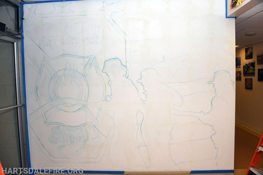 Outlined mural featuring firefighters and badge design, "Hartsdale Fire District" text visible.