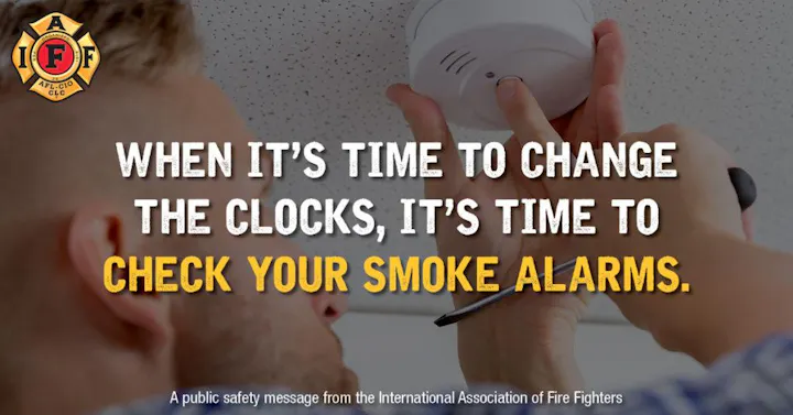 Person checking a smoke alarm. Text: "When it's time to change the clocks, it's time to check your smoke alarms."