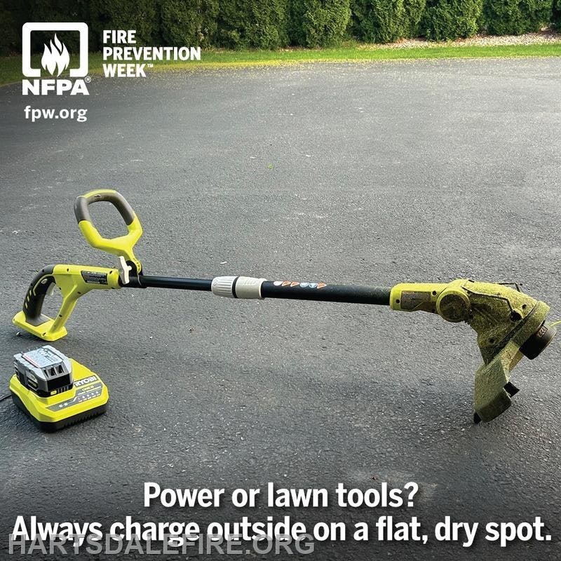 Image of a lawn tool with a battery, promoting fire safety by advising to charge outside on a flat, dry surface.