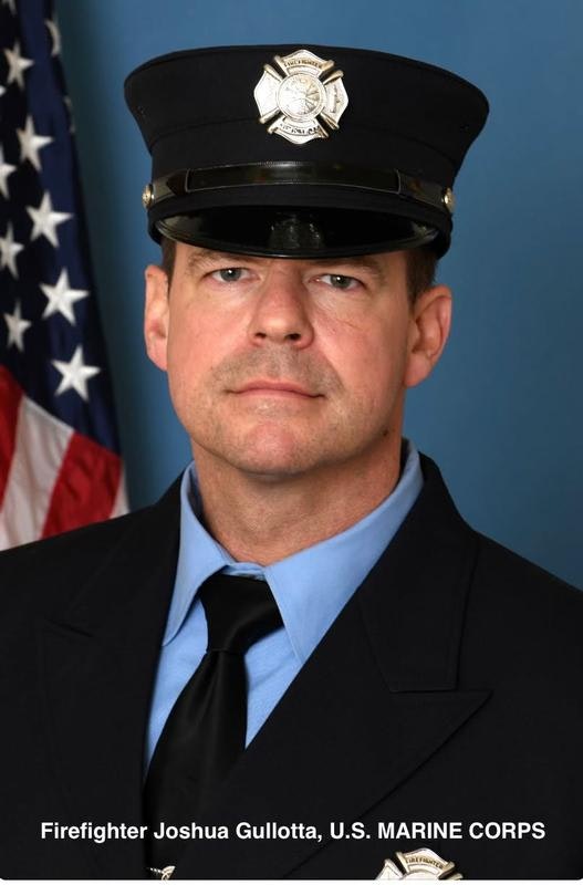 The image shows a firefighter in uniform, facing forward, with an American flag in the background.