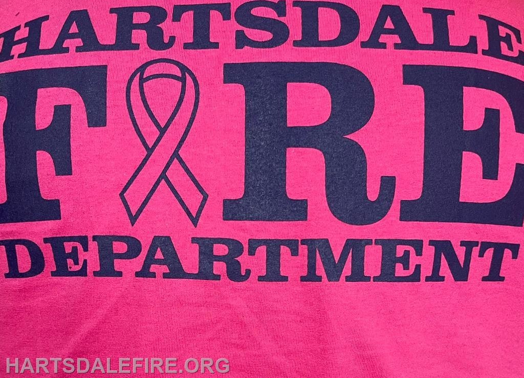 Pink shirt with "Hartsdale Fire Department" and a ribbon design.