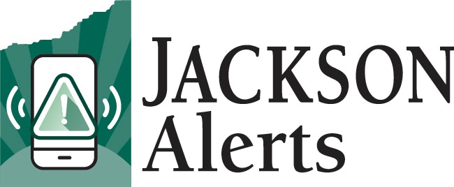 Logo with a smartphone illustration displaying an alert symbol, alongside the text "Jackson Alerts."