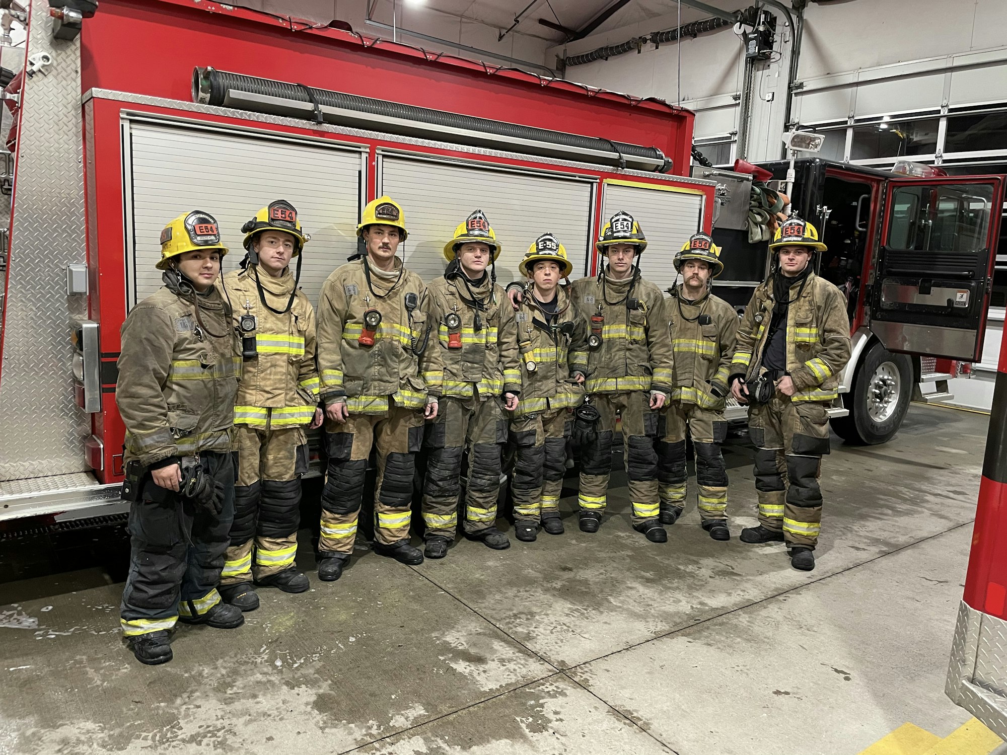 Firefighters posing for picture in bunker gear