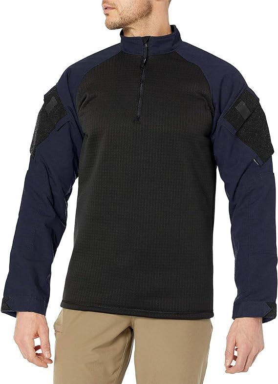 A person wearing a tactical-style quarter-zip pullover shirt with shoulder patches.