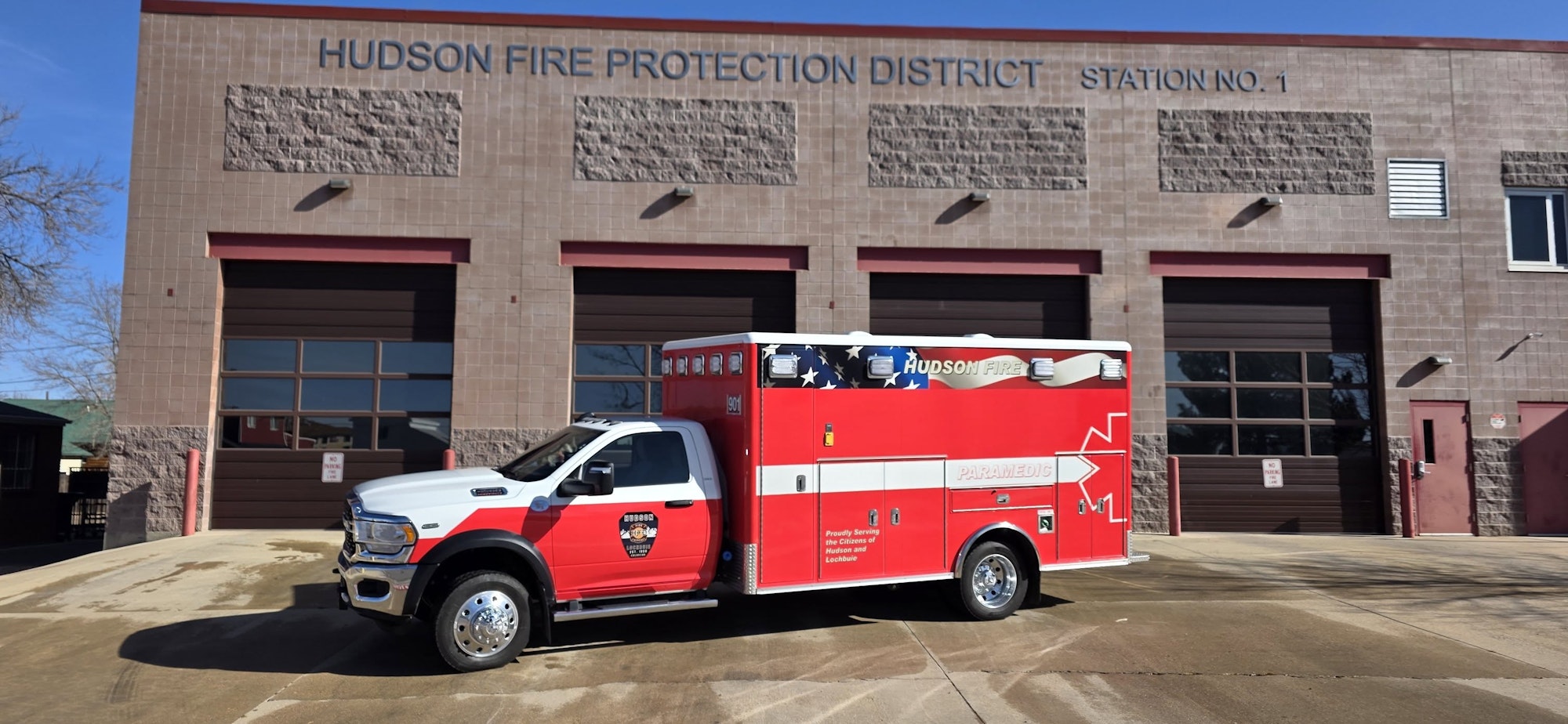 An emergency vehicle parked in front of the Hudson Fire Protection District Station No. 1.