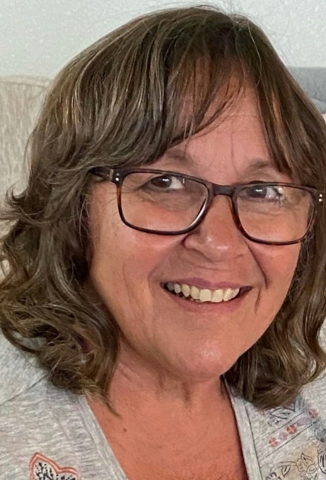 McKinney Water District Director Kim Arcidiacono Portrait of a smiling woman with glasses and brown hair.