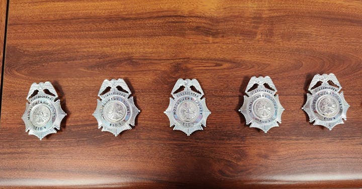 May contain: badge, logo, symbol, and wood