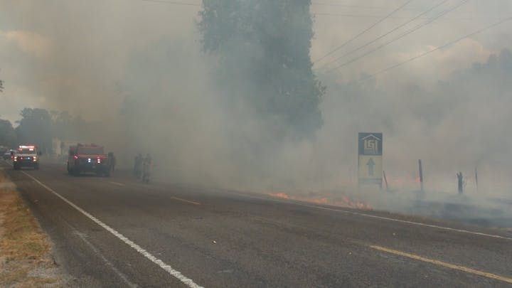 May contain: nature, outdoors, weather, fog, road, car, transportation, vehicle, smoke, and person