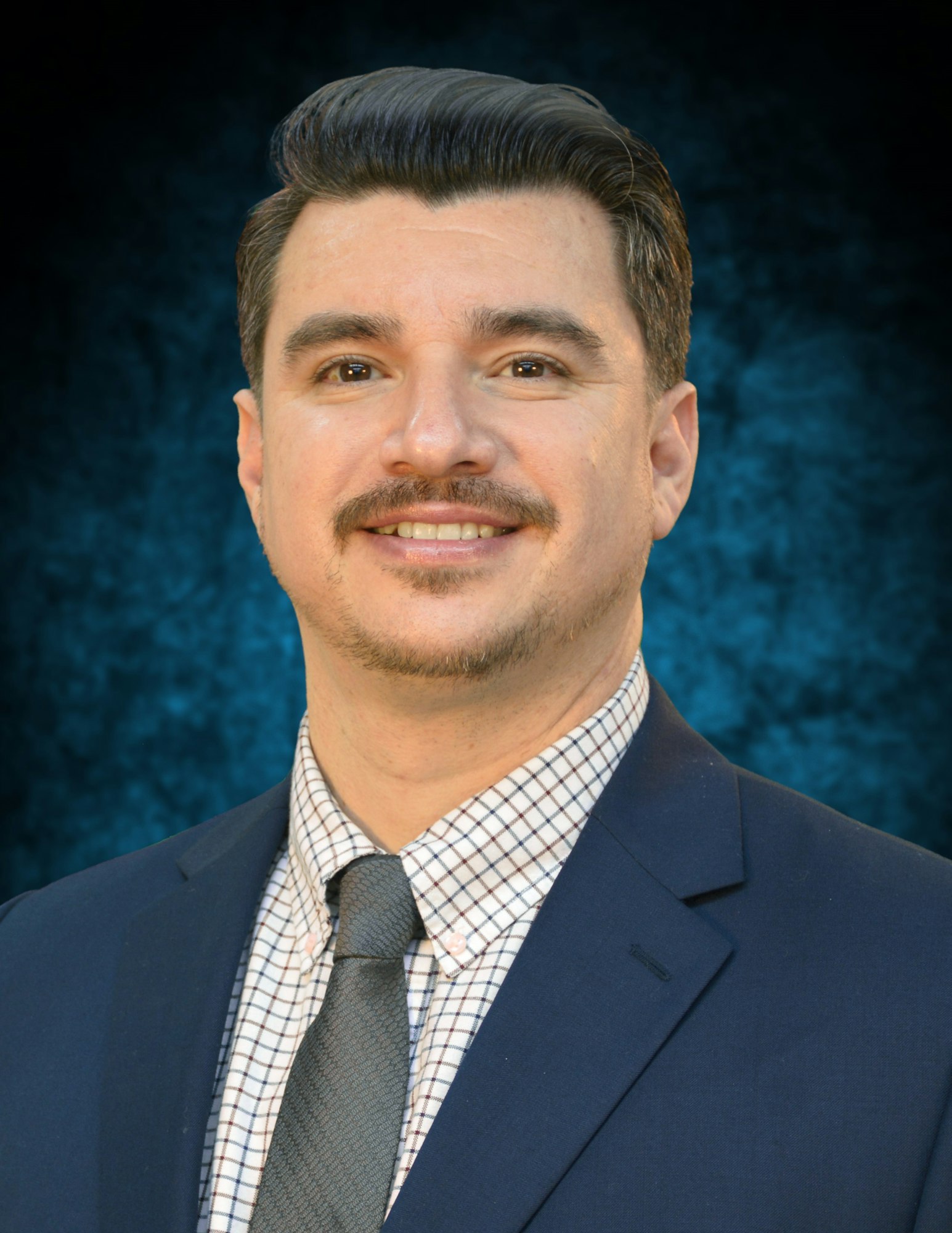 May contain: accessories, formal wear, tie, necktie, head, person, adult, male, man, face, clothing, suit, shirt, photography, portrait, blazer, coat, and jacket