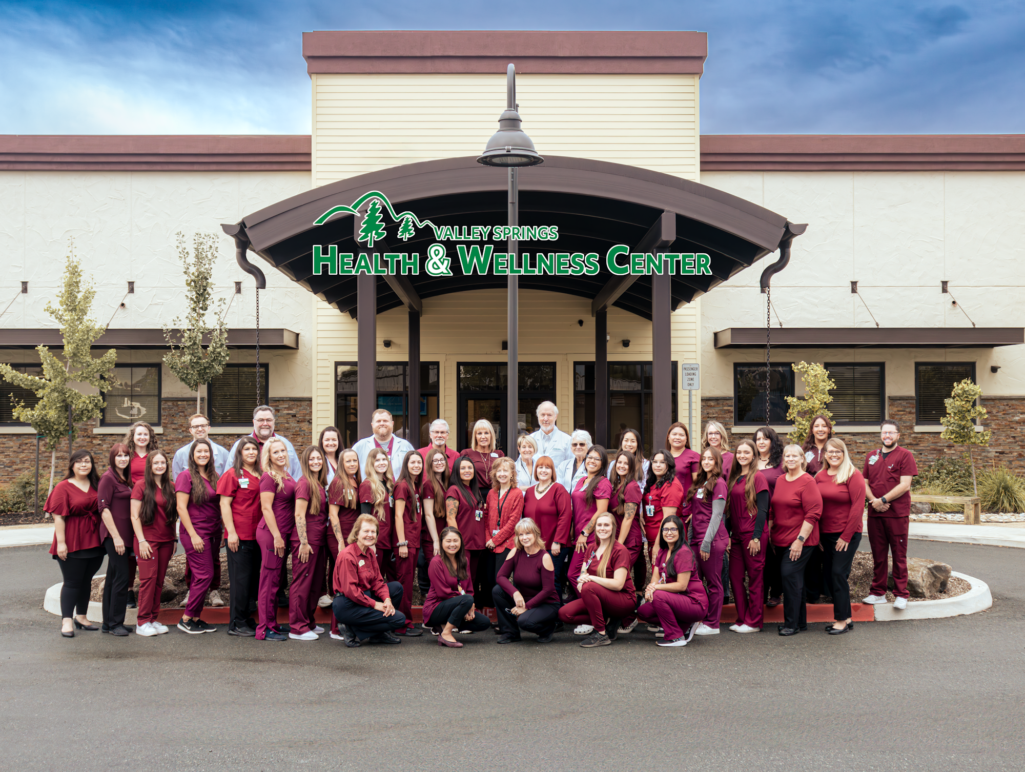 May contain: architecture, building, college, person, clothing, footwear, shoe, and lamp