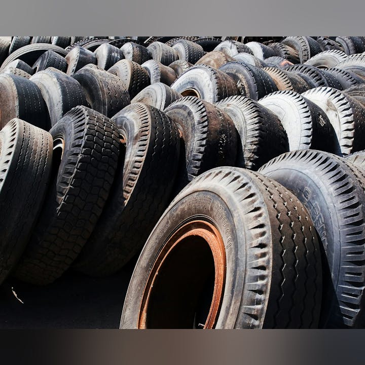 A pile of various used tires.