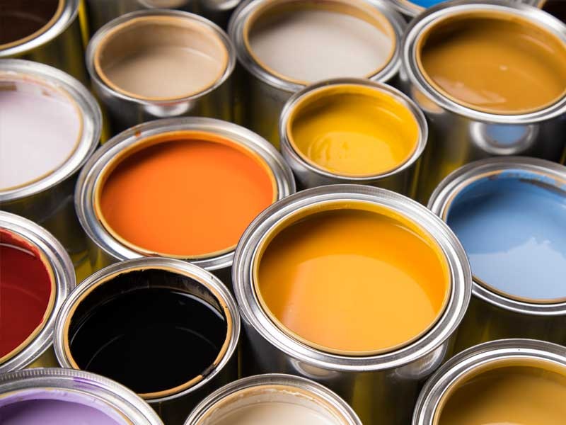 Open paint cans with various colors.