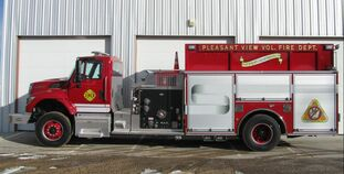 May contain: transportation, truck, vehicle, fire truck, fire station, moving van, and van