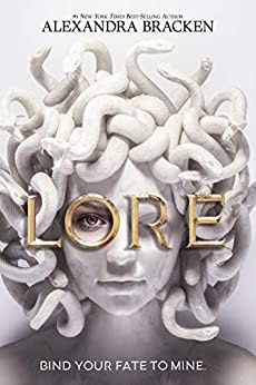 The book "Lore" by Alexandra Bracken with a head with snakes for hair