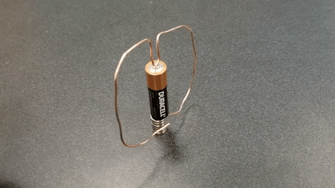 A homopolar motor - bent wire spins on a battery