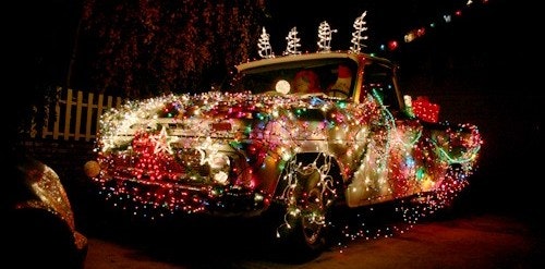 May contain: crowd, parade, lighting, vehicle, and transportation