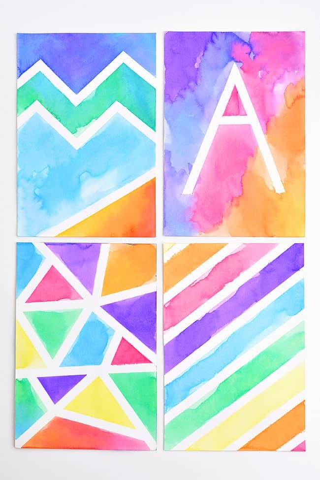 Four colorful, abstract watercolor artworks featuring various geometric patterns and a prominent letter "A."