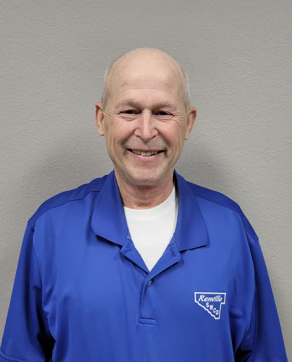 Supervisor Brad Nere smiling, wearing a blue polo shirt with "Renville SWCD" logo.