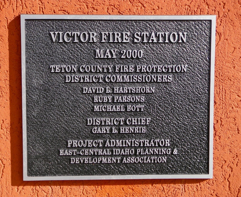 A plaque for Victor Fire Station dedicated in May 2000 with names of Teton County fire protection commissioners, the district chief, and project administrator.