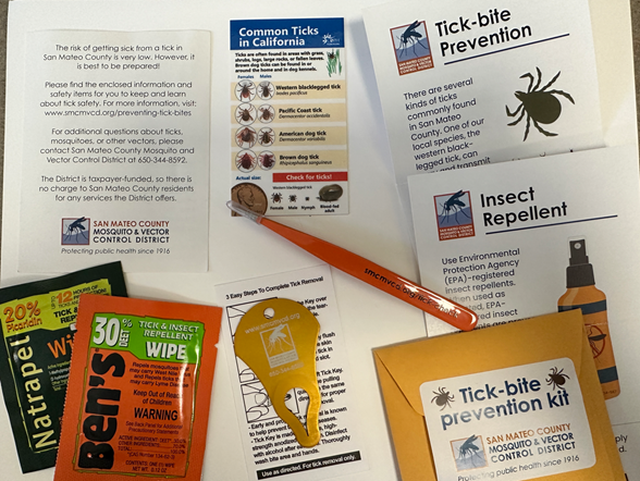 Photograph of various papers with words including: tick-bite prevention, insect repellent, common ticks of California, tick-bite prevention kit. A pair of orange tweezers, a yellow device for removing ticks, and two packets of insect repellent wipes.