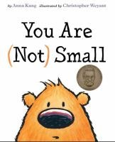 Book cover titled "You Are (Not) Small" with a cartoon monster-like creature and a medal icon.