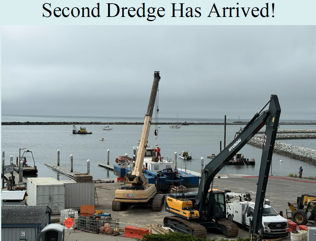 A construction site near water with cranes, a dredge, and boats. Text reads, "Second Dredge Has Arrived!"