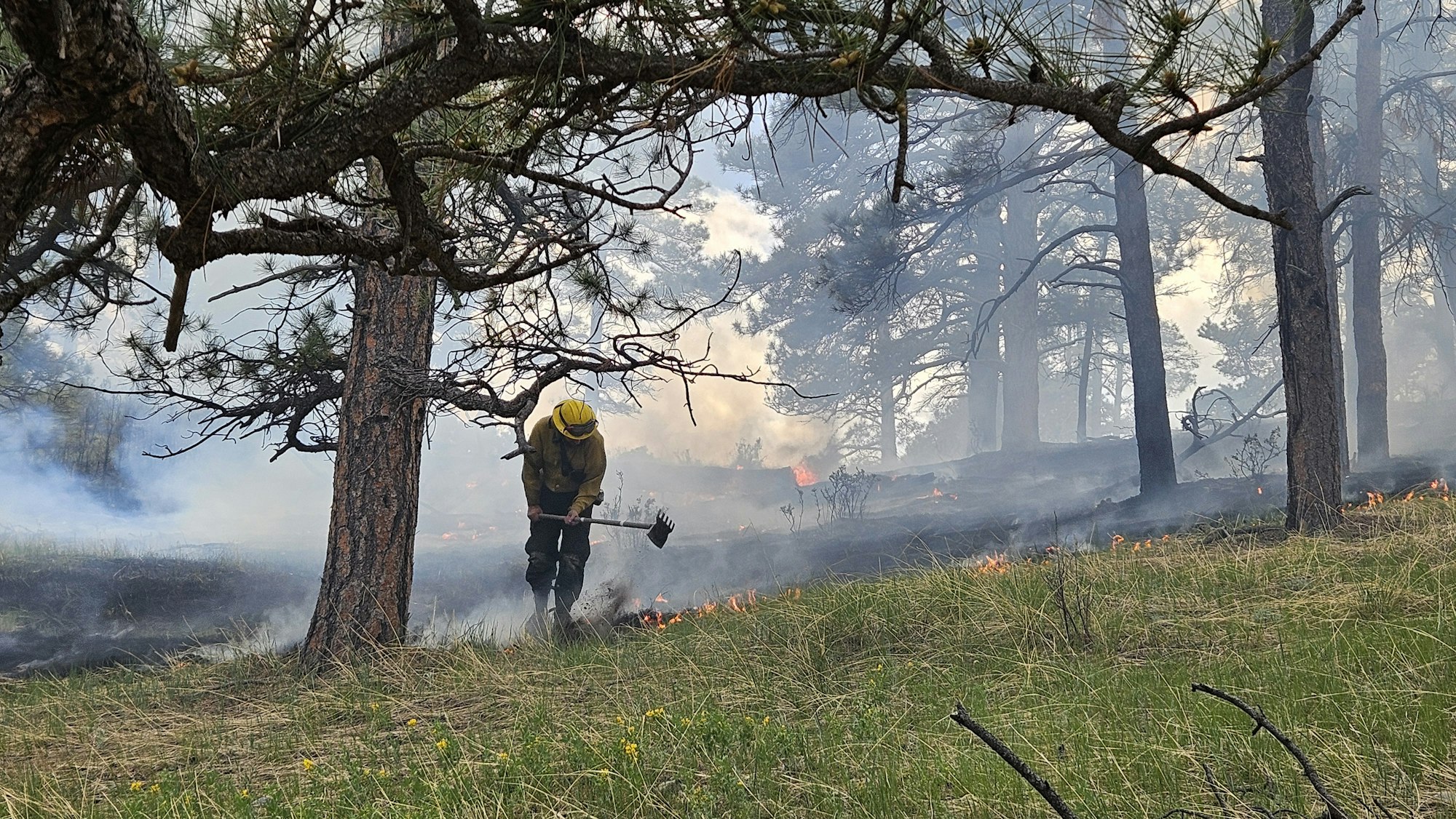 May contain: person, helmet, and fire