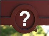 A circular sign with a white question mark on a red background, against a blurred backdrop.