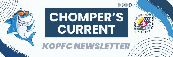 Graphic of a smiling shark with the text "Chomper's Current - KOPFC Newsletter" and water wave patterns.
