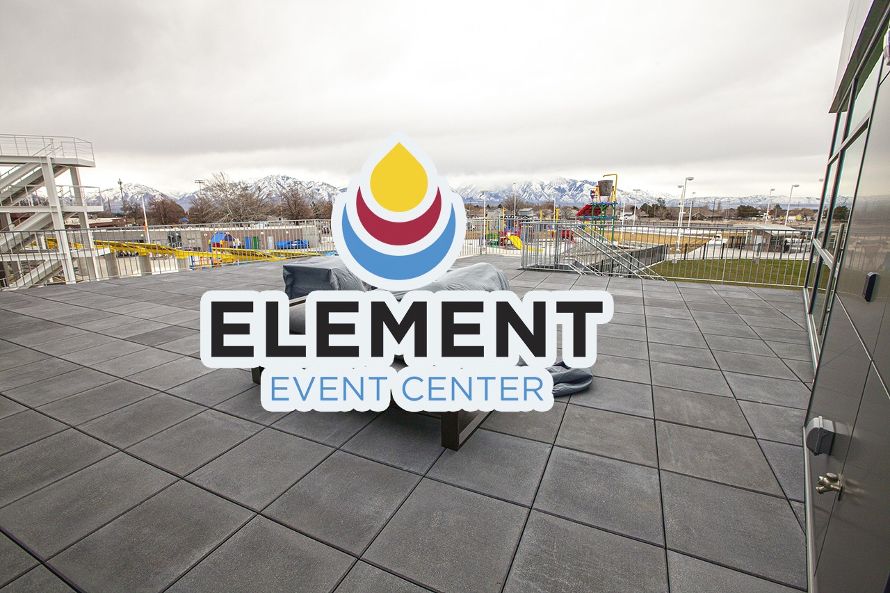 An outdoor terrace with a view of mountains, a playground nearby, and a logo overlay saying "Element Event Center."