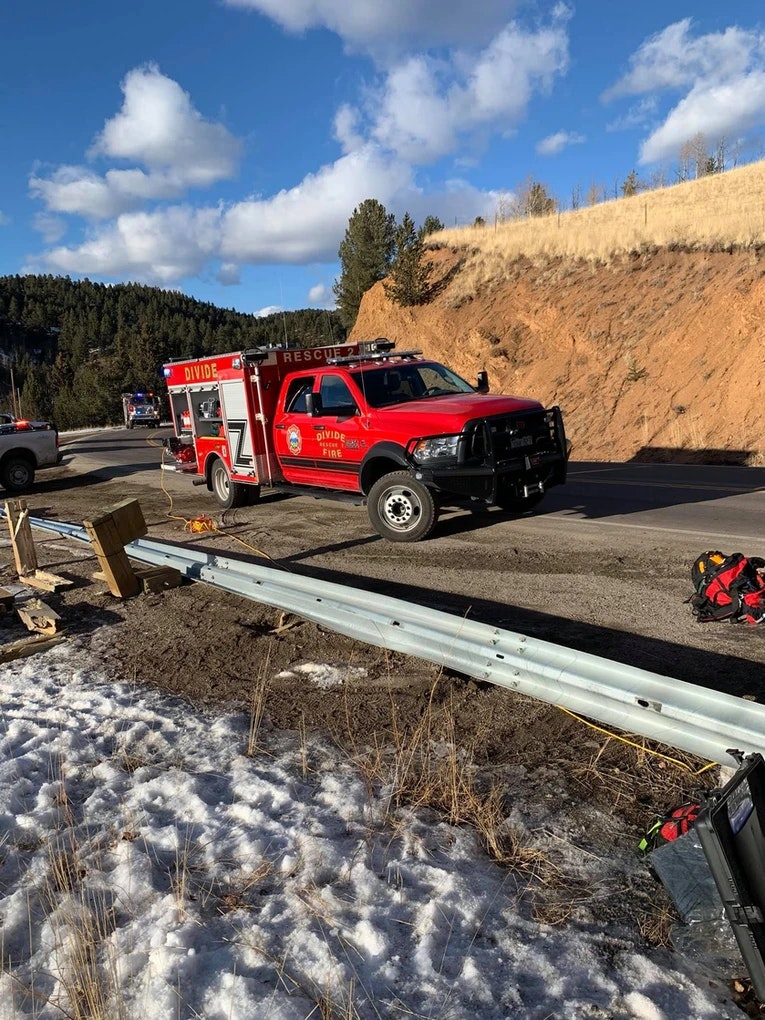 May Contain- Fire truck with dirt in background