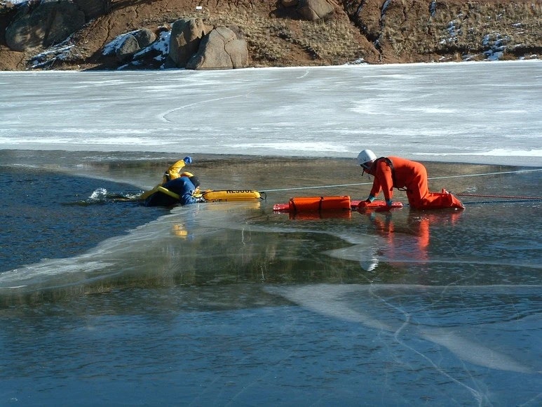 Members on lake with Ice on top of it