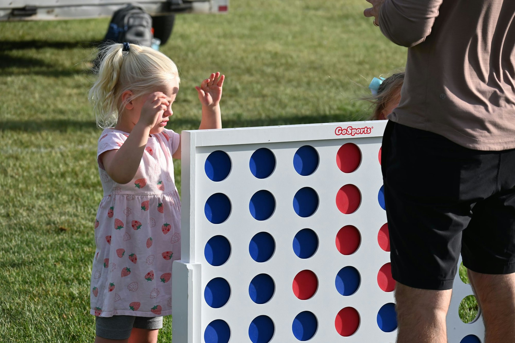 young girl playing connect four