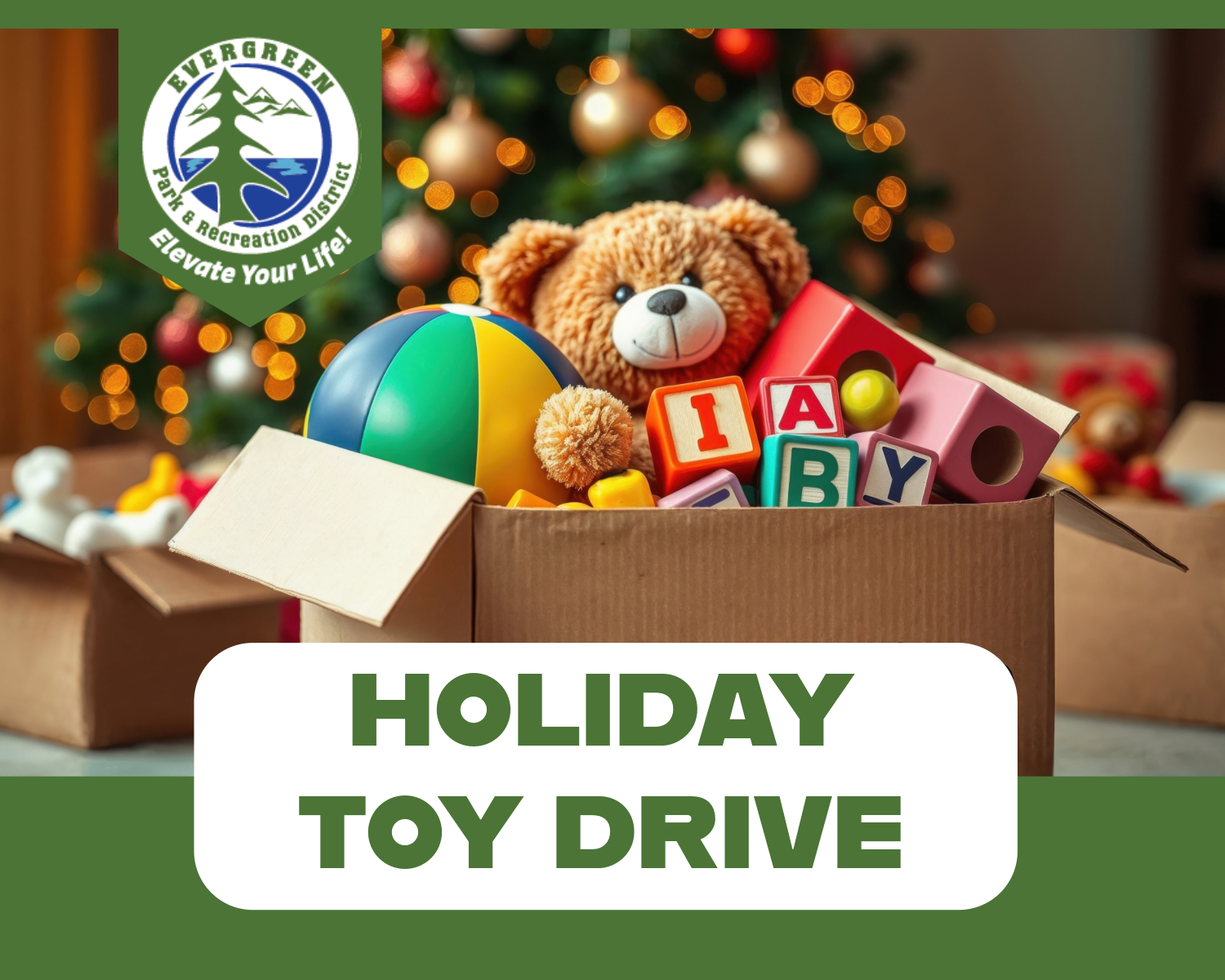 Box of toys in front of a Christmas tree with "HOLIDAY TOY DRIVE" text and Evergreen Park logo.