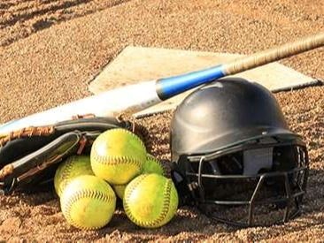 Baseball equipment on the ground: balls, bat, glove, and helmet.