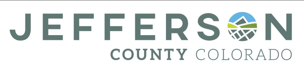 A logo with text "Jefferson County Colorado" and a graphic emblem combining a mountain, sun, and grid design.